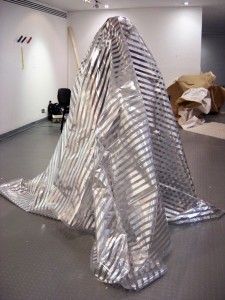 "Surveillance Blanket" by Daniel Baker (2008); gilded polythene; 4m x 3m; (c) Danel Baker